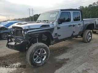 2020 Jeep Gladiator Sport S with VIN 1C6HJTAG9LL127546, listed as a Copart auction lot 54955945 with 99,511 mi miles and Salvage title. Bid and sale history available at DreamBid. Image 1.