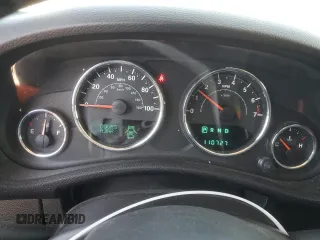 2013 Jeep Wrangler Sahara with VIN 1C4AJWBG8DL602065, listed as a Copart auction lot 52082535 with 110,727 mi miles and Salvage title. Bid and sale history available at DreamBid. Image 9.