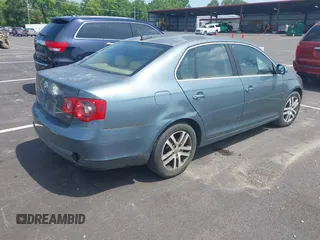 2006 Volkswagen Jetta 1.9L TDI z VIN 3VWST71K66M834544, wystawiony jako IAAI lot #42557527 z przebiegiem Nie podano mil oraz . Historia ofert i sprzedaży dostępna na DreamBid. Obrazek 4.