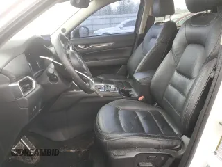 2019 Mazda CX-5 Grand Touring with VIN JM3KFBDM4K0669589, listed as a Copart auction lot 54948455 with 64,475 mi miles and Salvage Title. Bid and sale history available at carsss.com. Image 7.