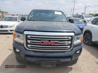 2019 GMC Canyon 4WD SLE z VIN 1GTG6CENXK1261278, wystawiony jako IAAI lot #42064295 z przebiegiem 51 786 mil mil oraz . Historia ofert i sprzedaży dostępna na DreamBid. Obrazek 12.