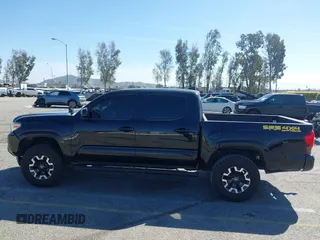 2018 Toyota Tacoma SR with VIN 3TMCZ5AN2JM127244, listed as a IAAI auction lot 41698199 with 61,535 mi miles and . Bid and sale history available at DreamBid. Image 14.