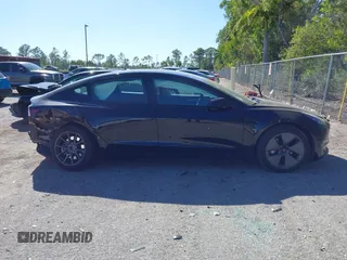 2023 Tesla Model 3 with VIN 5YJ3E1EAXPF623403, listed as a IAAI auction lot 41829543 with 29,414 mi miles and . Bid and sale history available at carsss.com. Image 14.