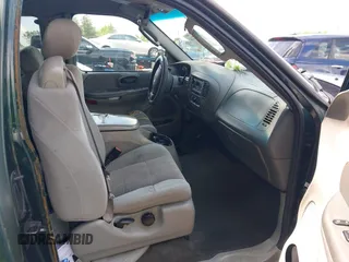 2003 Ford F-150 XL with VIN 1FTRX17283NB64085, listed as a IAAI auction lot 42477224 with Not provided miles and . Bid and sale history available at DreamBid. Image 5.