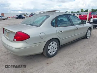 2003 Ford Taurus LX Standard z VIN 1FAFP52U43A149177, wystawiony jako IAAI lot #42227480 z przebiegiem 140 379 mil mil oraz . Historia ofert i sprzedaży dostępna na DreamBid. Obrazek 4.