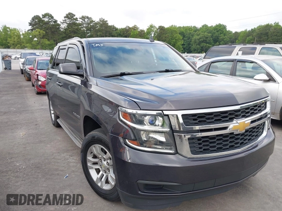 2015 Chevrolet Tahoe LS with VIN 1GNSCAKC0FR245826, listed as a IAAI auction lot 42282590 with 164,208 mi miles and . Bid and sale history available at DreamBid. Image 1.