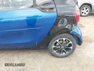 2016 Smart fortwo Passion z VIN WMEFJ5DA8GK059871, wystawiony jako IAAI lot #41624917 z przebiegiem 90 906 mil mil oraz . Historia ofert i sprzedaży dostępna na DreamBid. Obrazek 6.