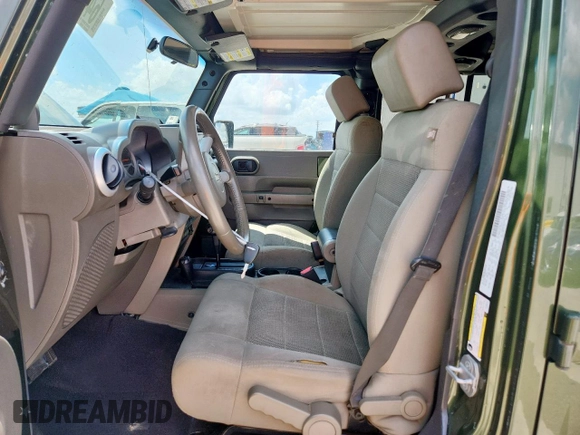 2008 Jeep Wrangler Unlimited Sahara with VIN 1J4GA59148L608970, listed as a Copart auction lot 64433495 with 134,055 mi miles and Salvage title. Bid and sale history available at DreamBid. Image 7.
