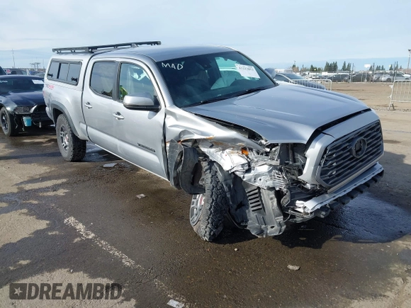 2021 Toyota Tacoma 4WD SR5 with VIN 3TMDZ5BN1MM105694, listed as a IAAI auction lot 41233853 with 1 mi miles. Bid and sale history available at carsss.com. Image 1.
