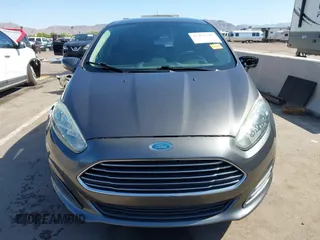 2015 Ford Fiesta SE z VIN 3FADP4EJ0FM146237, wystawiony jako IAAI lot #42452345 z przebiegiem 121 742 mil mil oraz . Historia ofert i sprzedaży dostępna na DreamBid. Obrazek 12.