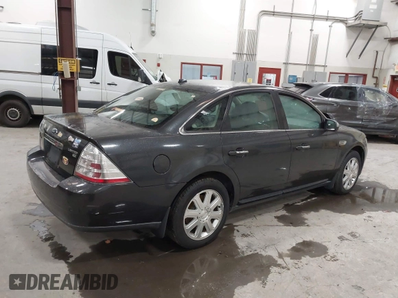 2008 Ford Taurus Limited with VIN 1FAHP28W08G141243, listed as a IAAI auction lot 41327967 with 157,482 mi miles. Bid and sale history available at carsss.com. Image 4.