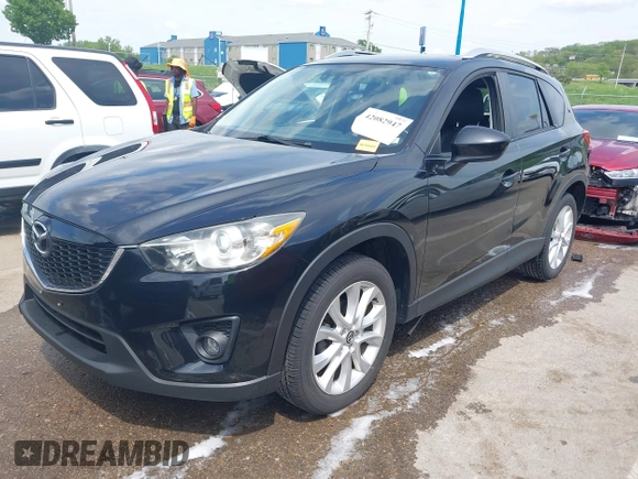 2013 Mazda CX-5 Grand Touring with VIN JM3KE4DE6D0148030, listed as a IAAI auction lot 42082947 with 119,432 mi miles and . Bid and sale history available at DreamBid. Image 2.