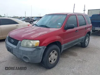 2005 Ford Escape XLS Value with VIN 1FMYU02Z35KB05027, listed as a IAAI auction lot 42025362 with 208,413 mi miles. Bid and sale history available at carsss.com. Image 2.
