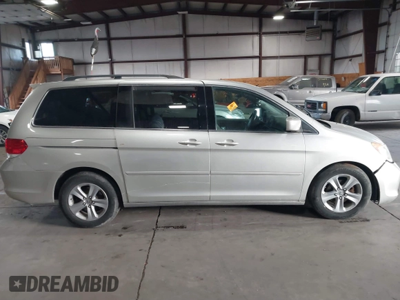 2009 Honda Odyssey Touring с VIN 5FNRL38979B005813, выставлен на аукционе IAAI как лот 41049383 с пробегом 174 897 миль миль и . История ставок и продаж доступна на DreamBid. Изображение 13.