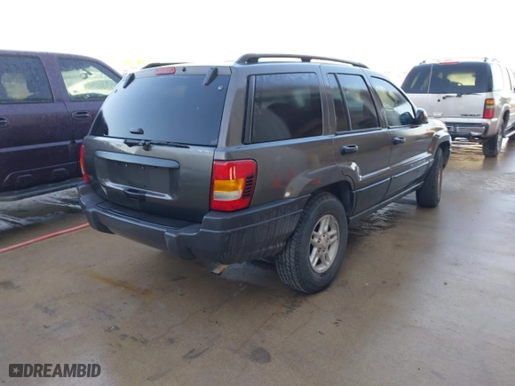 2004 Jeep Grand Cherokee Laredo with VIN 1J4GX48S04C394024, listed as a IAAI auction lot 41982608 with 142,825 mi miles. Bid and sale history available at carsss.com. Image 4.