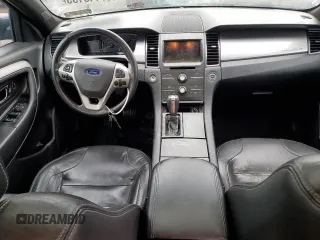 2013 Ford Taurus SEL z VIN 1FAHP2E87DG104349, wystawiony jako Copart lot #57143135 z przebiegiem 129 927 mil mil oraz Szkoda całkowita • Salvage title. Historia ofert i sprzedaży dostępna na DreamBid. Obrazek 8.