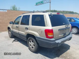 2001 Jeep Grand Cherokee Laredo with VIN 1J4GX48S01C606559, listed as a IAAI auction lot 42384286 with 149,146 mi miles and . Bid and sale history available at DreamBid. Image 3.