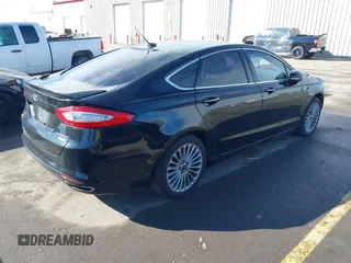 2016 Ford Fusion Titanium with VIN 3FA6P0K9XGR152837, listed as a IAAI auction lot 41647436 with 196,700 mi miles. Bid and sale history available at carsss.com. Image 4.