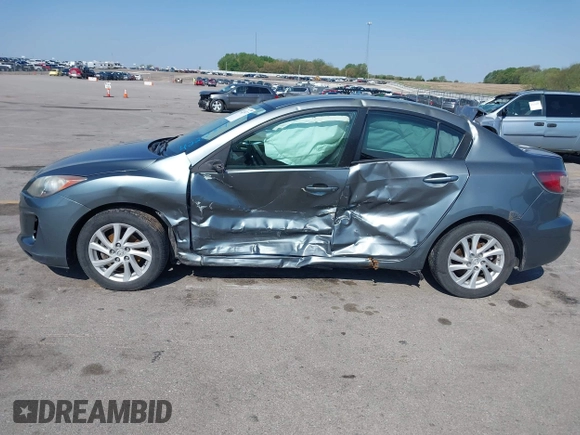 2012 Mazda 3 i Touring z VIN JM1BL1V73C1695634, wystawiony jako IAAI lot #42223477 z przebiegiem 138 302 mil mil oraz . Historia ofert i sprzedaży dostępna na DreamBid. Obrazek 14.