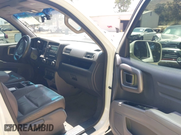 2012 Honda Ridgeline RTL z VIN 5FPYK1F57CB455267, wystawiony jako IAAI lot #42462296 z przebiegiem 186 451 mil mil oraz . Historia ofert i sprzedaży dostępna na DreamBid. Obrazek 5.