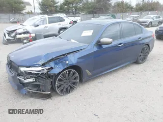 2018 BMW 5 Series M550i xDrive with VIN WBAJB9C56JG463891, listed as a IAAI auction lot 41731556 with 104,860 mi miles. Bid and sale history available at carsss.com. Image 2.