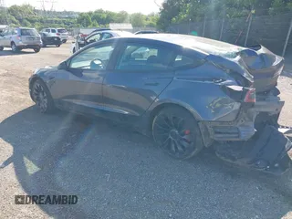 2023 Tesla Model 3 Performance z VIN 5YJ3E1ECXPF482320, wystawiony jako IAAI lot #42289417 z przebiegiem 31 296 mil mil oraz . Historia ofert i sprzedaży dostępna na DreamBid. Obrazek 3.