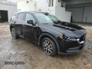 2018 Mazda CX-5 Touring z VIN JM3KFBCM4J0377280, wystawiony jako Copart lot #56688575 z przebiegiem 101 167 mil mil oraz Czysty tytuł • Clean title. Historia ofert i sprzedaży dostępna na DreamBid. Obrazek 4.