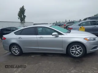 2016 Ford Fusion SE z VIN 3FA6P0H76GR385328, wystawiony jako IAAI lot #42408631 z przebiegiem 127 293 mil mil oraz . Historia ofert i sprzedaży dostępna na DreamBid. Obrazek 13.