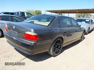 2001 BMW 7 Series 740iL with VIN WBAGH83421DP25417, listed as a IAAI auction lot 41725971 with 165,599 mi miles. Bid and sale history available at carsss.com. Image 4.