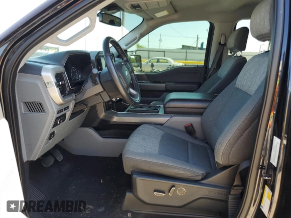 2021 Ford F-150 XL with VIN 1FTFW1E5XMFA47980, listed as a Copart auction lot 56737215 with 63,781 mi miles and Salvage title. Bid and sale history available at DreamBid. Image 7.