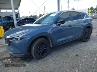 2023 Mazda CX-5 S Carbon Edition z VIN JM3KFBCM5P0179543, wystawiony jako IAAI lot #41950082 z przebiegiem 31 573 mil mil oraz . Historia ofert i sprzedaży dostępna na DreamBid. Obrazek 2.