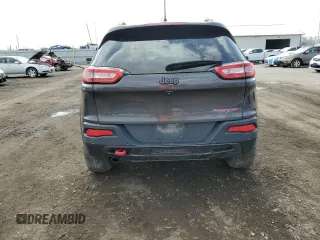 2018 Jeep Cherokee Trailhawk with VIN 1C4PJMBB0JD561309, listed as a Copart auction lot 51487065 with 105,138 mi miles and Salvage title. Bid and sale history available at DreamBid. Image 6.