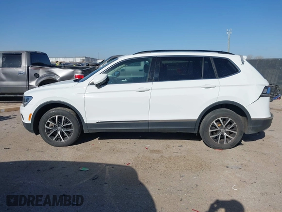 2021 Volkswagen Tiguan SE with VIN 3VV3B7AX9MM051920, listed as a IAAI auction lot 41826721 with 127,699 mi miles and . Bid and sale history available at DreamBid. Image 14.