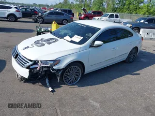 2015 Volkswagen CC R-Line with VIN WVWBN7AN3FE819870, listed as a IAAI auction lot 39390950 with 86,082 mi miles. Bid and sale history available at carsss.com. Image 2.