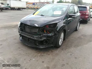 2015 Ford C-Max Energi SEL with VIN 1FADP5CU6FL110038, listed as a IAAI auction lot 41953446 with 56,097 mi miles. Bid and sale history available at carsss.com. Image 2.