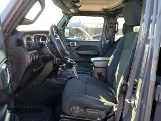 2020 Jeep Wrangler Unlimited Willys with VIN 1C4HJXDG5LW348507, listed as a Copart auction lot 77000574 with 57,056 mi miles and Salvage title. Bid and sale history available at DreamBid. Image 7.