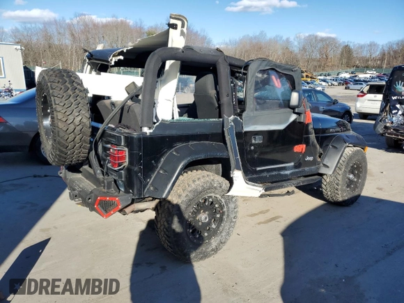 2004 Jeep Wrangler Rubicon with VIN 1J4FA69S74P785297, listed as a Copart auction lot 47332944 with 61,323 mi miles and Salvage Title. Bid and sale history available at carsss.com. Image 3.