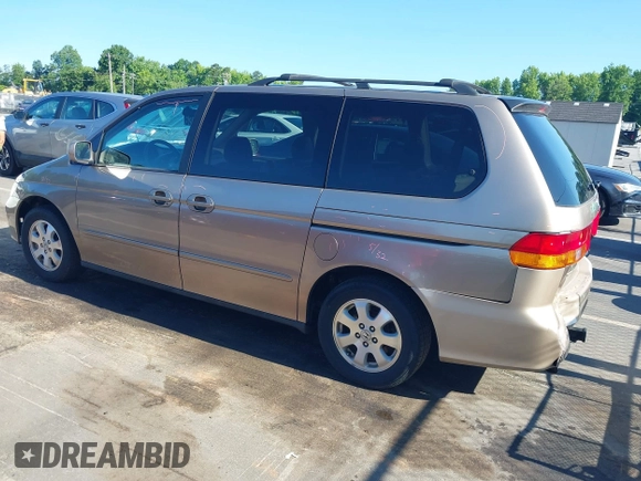 2004 Honda Odyssey EX-L with VIN 5FNRL18044B072819, listed as a IAAI auction lot 42441279 with 264,950 mi miles and . Bid and sale history available at DreamBid. Image 3.
