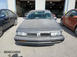 1990 Oldsmobile Cutlass z VIN 2G3AL54R2L2339637, wystawiony jako Copart lot #78364484 z przebiegiem 89 106 mil mil oraz Tytuł czysty. Historia ofert i sprzedaży dostępna na DreamBid. Obrazek 5.