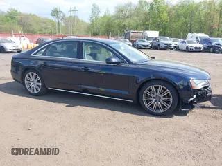2014 Audi A8 3.0T z VIN WAURGAFD7EN005979, wystawiony jako IAAI lot #42169900 z przebiegiem 126 523 mil mil oraz . Historia ofert i sprzedaży dostępna na DreamBid. Obrazek 1.