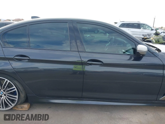 2019 BMW 5 Series M550i xDrive with VIN WBAJB9C51KB287797, listed as a IAAI auction lot 41549311 with 61,459 mi miles and . Bid and sale history available at DreamBid. Image 13.