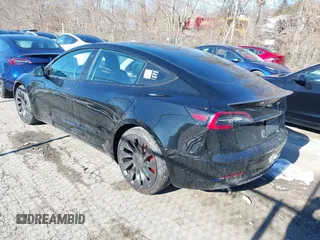 2021 Tesla Model 3 Performance with VIN 5YJ3E1EC5MF090518, listed as a IAAI auction lot 38775658 with 14,118 mi miles and . Bid and sale history available at carsss.com. Image 3.