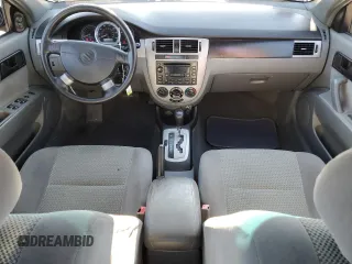 2006 Suzuki Forenza z VIN KL5JD56ZX6K278029, wystawiony jako Copart lot #82026904 z przebiegiem 117 700 mil mil oraz Szkody całkowita. Historia ofert i sprzedaży dostępna na DreamBid. Obrazek 8.