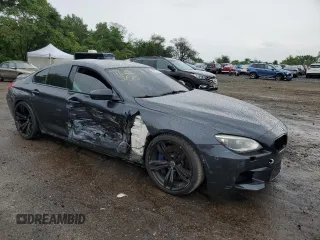 2015 BMW M6 z VIN WBS6C9C59FD467943, wystawiony jako Copart lot #63477904 z przebiegiem 80 186 mil mil oraz Szkody całkowita. Historia ofert i sprzedaży dostępna na DreamBid. Obrazek 4.