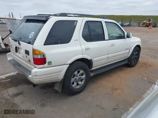 1998 Isuzu Rodeo S with VIN 4S2CM58W0W4331738, listed as a IAAI auction lot 42074562 with 237,684 mi miles. Bid and sale history available at carsss.com. Image 4.