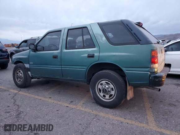 1996 Isuzu Rodeo z VIN 4S2CK58E1T4331031, wystawiony jako Copart lot #78573514 z przebiegiem 218 994 mil mil oraz Szkody całkowita. Historia ofert i sprzedaży dostępna na DreamBid. Obrazek 2.
