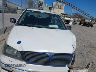 2002 Mitsubishi Lancer OZ-Rally with VIN JA3AJ86E42U039140, listed as a IAAI auction lot 41853888 with 328,181 mi miles. Bid and sale history available at carsss.com. Image 12.