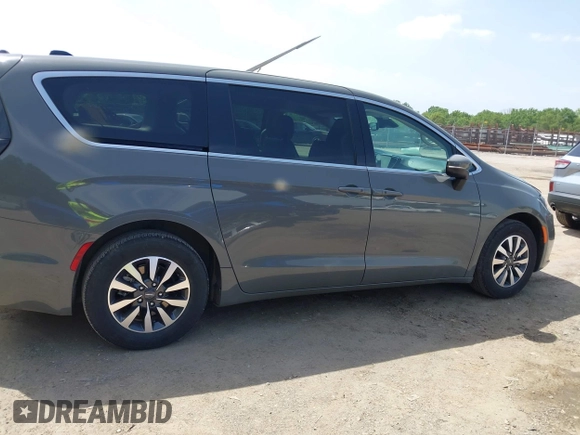 2023 Chrysler Pacifica Hybrid Touring L with VIN 2C4RC1L73PR522988, listed as a IAAI auction lot 42280263 with 54,939 mi miles and . Bid and sale history available at DreamBid. Image 13.