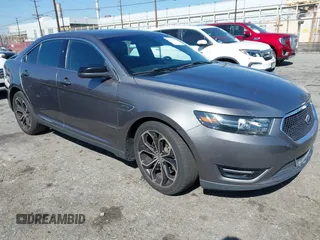 2014 Ford Taurus SHO with VIN 1FAHP2KT4EG100043, listed as a IAAI auction lot 41652377 with 129,263 mi miles. Bid and sale history available at carsss.com. Image 1.