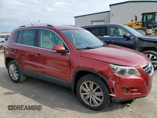 2011 Volkswagen Tiguan SE with VIN WVGBV7AX7BW001124, listed as a Copart auction lot 53044005 with 150,072 mi miles and Salvage Title. Bid and sale history available at DreamBid. Image 4.